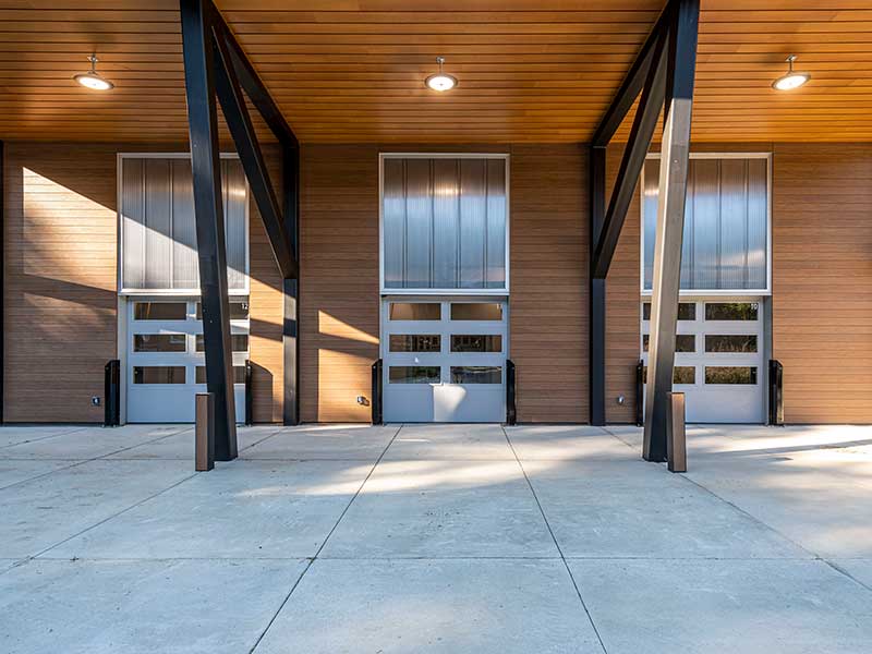 three bay entrances on the outside of the rice rivers center research facility