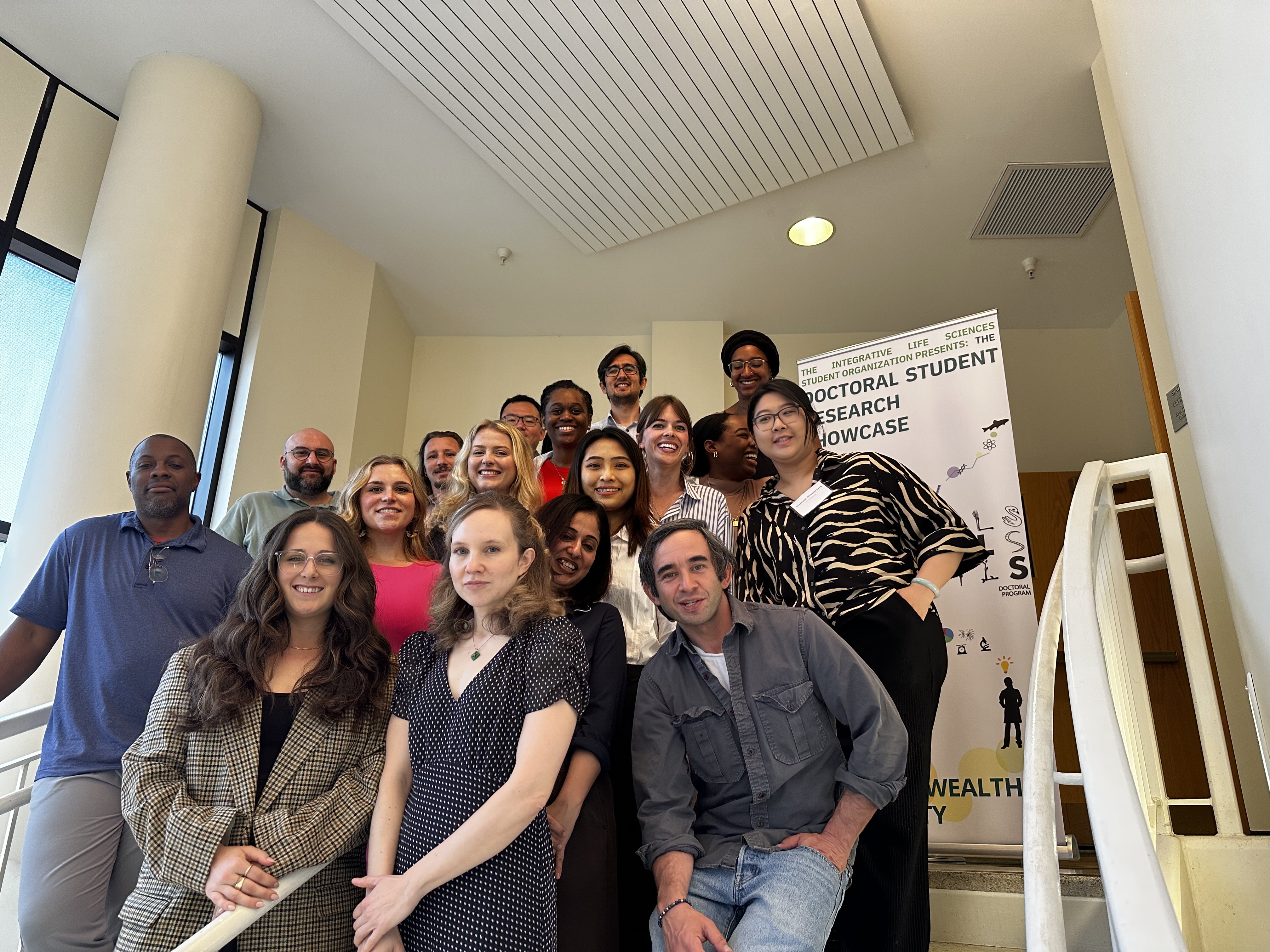 Group of Ph.D. students standing on a stairs for a group photo