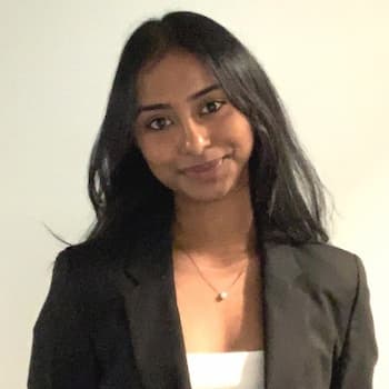 Student in suit standing