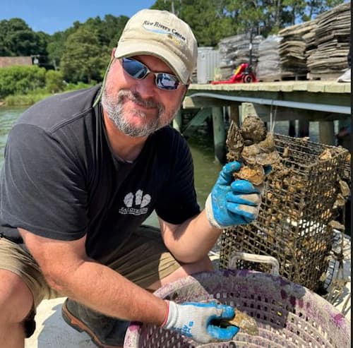 Tod holding Oyster shucks